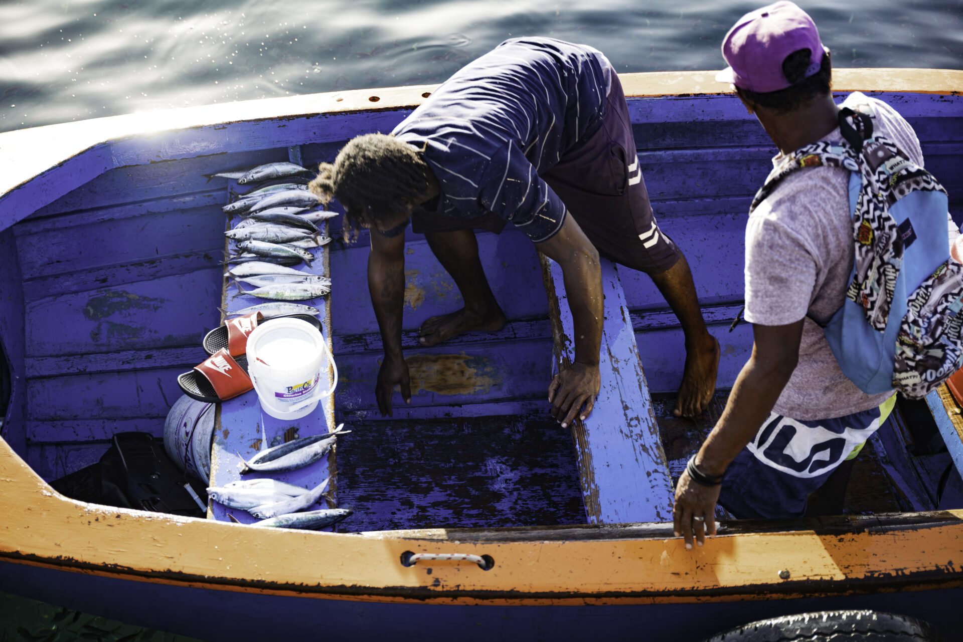 aquatic-animal_two fishermen in a boat attempting to catch fish